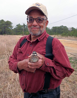 Doug Ramseur holding a quail